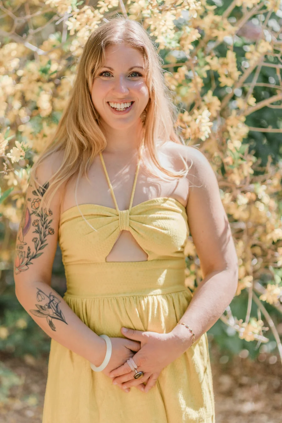 Megan Long, intuitive medium and energy healer, smiling in a garden